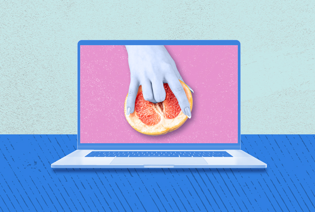 A laptop shows a hand dipping the two middle fingers into a grapefruit.