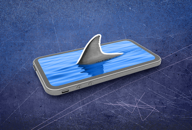 A cellphone lays flat as shark fin pokes out of the pool of water on the screen.