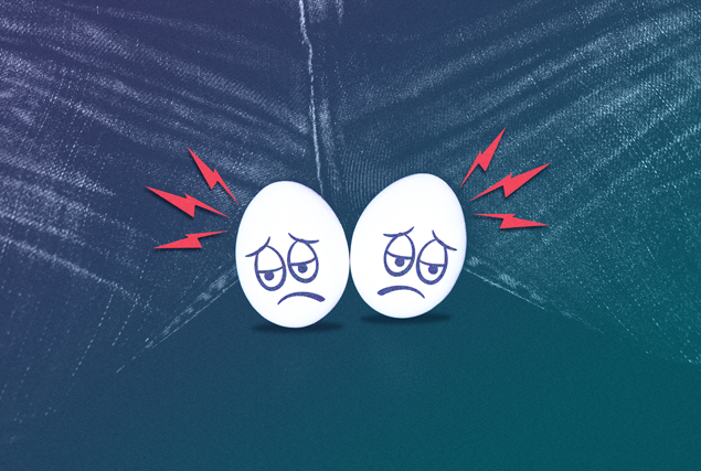 A pair of eggs with sad faces are paired together in the center of male crotch.
