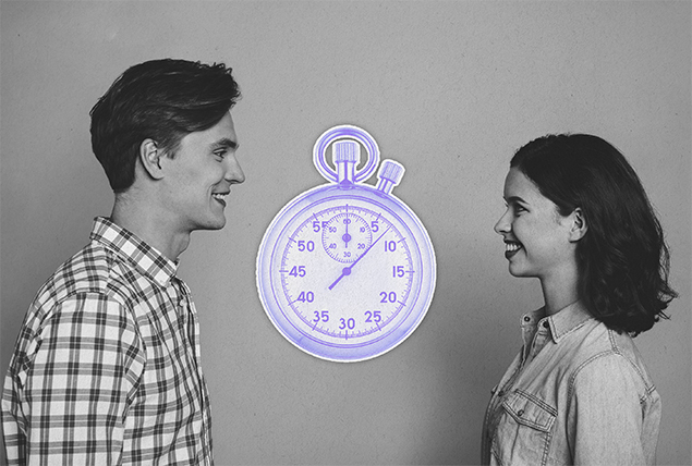 grayscale photo of man and woman facing each other smiling with purple stopwatch inbetween them