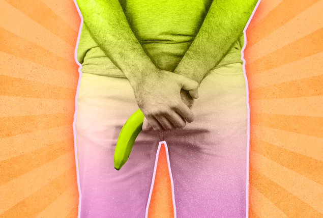 person with hands in front of pelvis with downturned banana on orange sunburst background