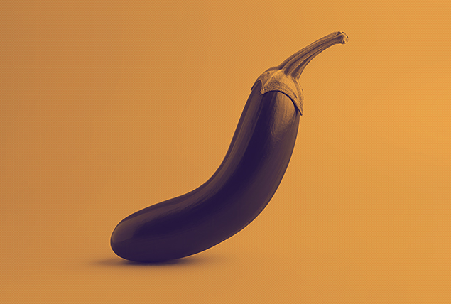 A curved eggplant sits upright against a golden background.