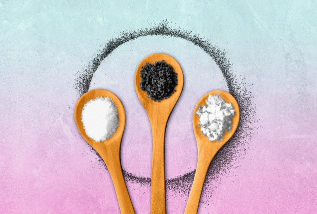 three wooden spoons with various minerals with black speckled halo on blue and pink gradient background