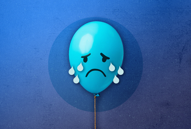 blue balloon with sad face crying on dark blue background