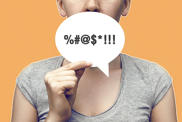 A chat bubble over a woman's mouth has symbols representing cursing.