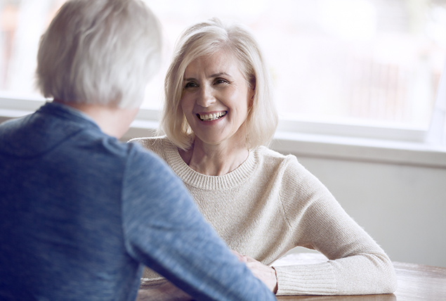 A woman talks to her male partner.