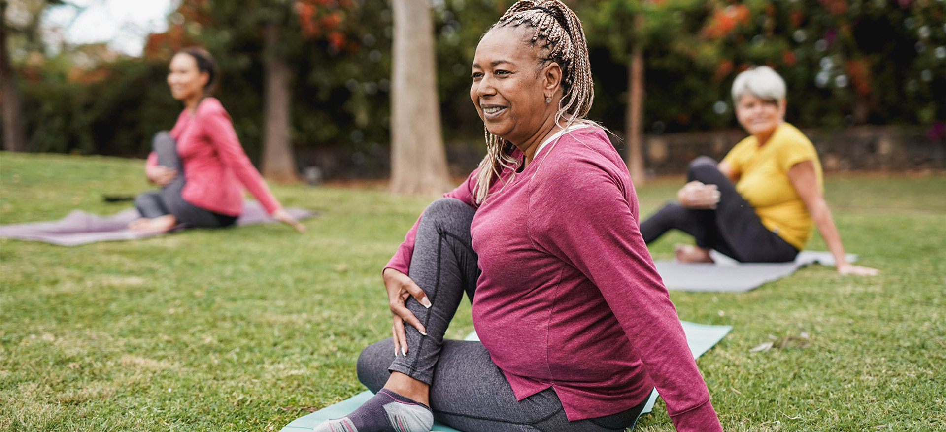 An-older-woman-stretches-on-a-mat