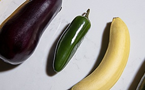 Various phallic vegetables are used to show different sizes and girth of a penis.