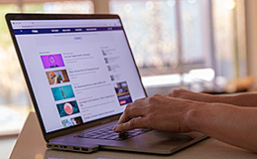 A person is searching on a laptop for information on the morning-after pill.