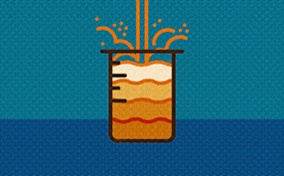 Urine pours into a beaker from above showing various shades of orange against a blue background.