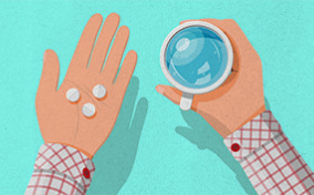A hand holding water and another hand holding baby aspirin.