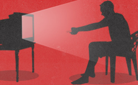 A-man-looks-at-tv-with-red-background