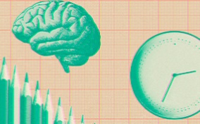 A brain, clock, and pencils on top of graph paper.