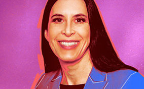 Genevieve Grabman poses in front of a fuchsia background.