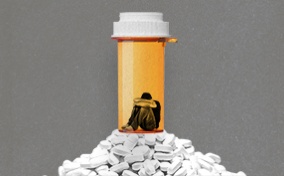 man-sits-inside-pill-bottle-atop-mountain-of-pills