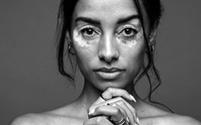 A-woman-stares-into-the-camera