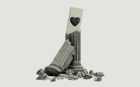 A broken Roman column reveals a cellphone with a heart on the back. 