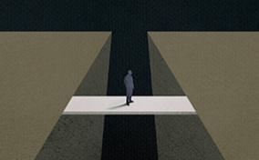 A man is crossing over a bridge to the other side.