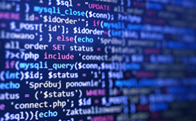 Colorful code covers a black background.