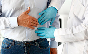 A doctor performs an exam on a male patient.