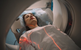 A woman is undergoing an MRI to detect endometriosis and adenomyosis.