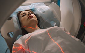 A woman is undergoing an MRI to detect endometriosis and adenomyosis.