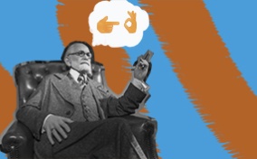 Sigmund Freud is sitting in a chair with a thought bubble of two emojis signifying sex.