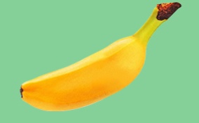A shrunken, floating banana casts a small shadow on its green background.