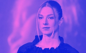 Trans actress Hunter Schafer from the TV show Euphoria poses for press photos with a purple overlay.