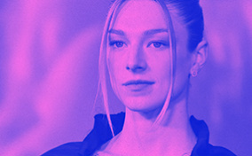 Trans actress Hunter Schafer from the TV show Euphoria poses for press photos with a purple overlay.