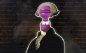 The bust of George Washington with a vibrator in place of his face sits against the Declaration of Independence.