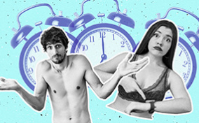 A man shrugs as a woman points to her wrist about the time with three alarm clocks behind them.