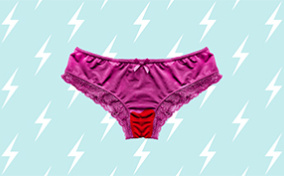Magenta panties with a red-stained crotch are on top of a light blue background with a repeating lightning pattern.