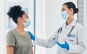 A woman talks to a doctor about her sexual healthcare.