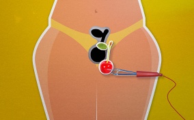 A cherry is being placed in the pelvic region of a female body in a mock operation game.