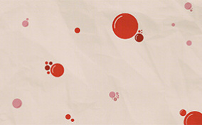 Blood droplets are scattered against an off-white surface.