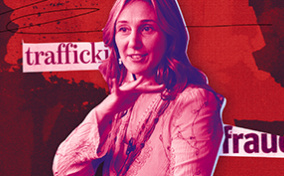 A woman gestures with her hands while she speaks, and the words "trafficking" and "fraud" are written behind her.