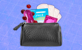 A variety of sexual health products for women are coming out of a black clutch.