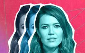 Mandy Moore's face is repeated three times, one stacking on the other, all in front of a red and purple background.