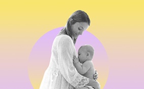 A woman holds her child as it breastfeeds against a yellow and lavender background.