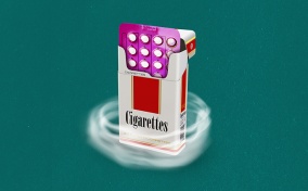An open pack of cigarettes reveals a pack of birth control on the inside.