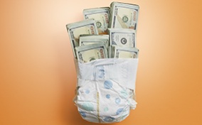 A diaper is wrapped around seven bundles of hundred-dollar bills.