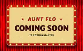 A retro coming soon sign for Aunt Flo is lit and hanging onto a red curtain with dark red droplets.
