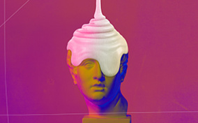 White cream falls down over the top of a roman statue head.