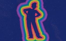 An kid with their hands on their hips is outlined by rainbow colors. 