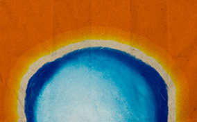 The top of a balding, blue head is in front of an orange background.