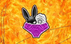 A black bunny mask and fireman badge poke out the top of purple underwear, and fire blazes in the background.