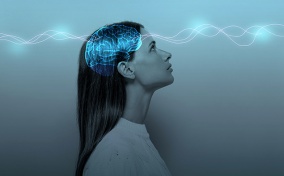 A blue outline of a brain glows inside the head of a woman as a white ribbon runs through it.