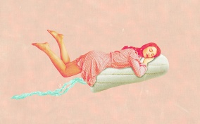 A woman is slepeing on top of a tampon.