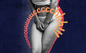A woman in a camisole and underwear holds her crotch in pain.